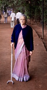 Leela's grandmother with her old cane on a walking path in India